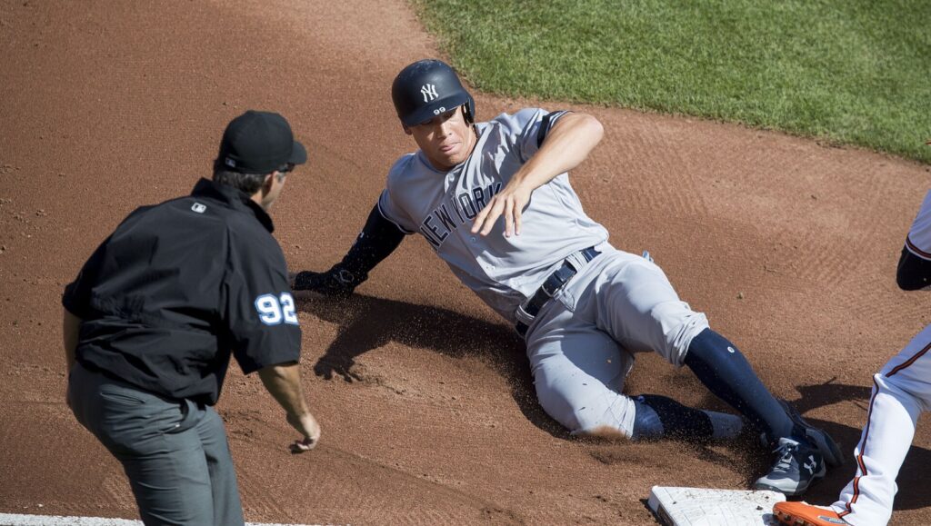 Aaron Judge of the New York Yankees slides into third base against the Baltimore Orioles in 2017